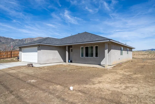 a front view of a house with a garage