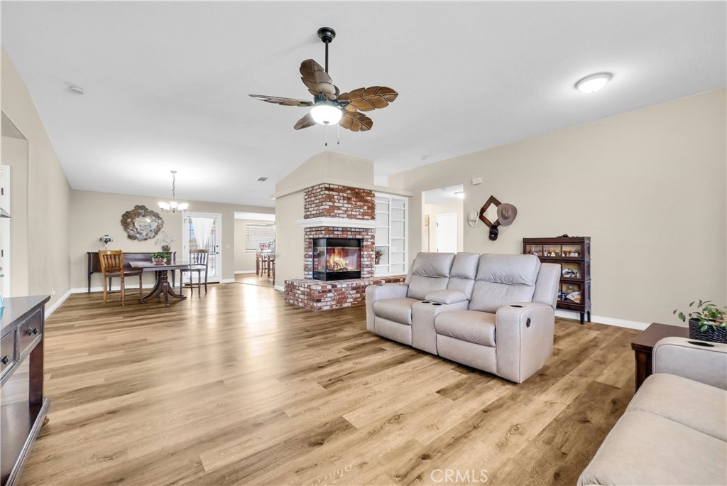 13931 Falling Leaf Road Apple Valley, CA 92307 - Photo 4 of 50 View of Living room with Fireplace open to Dining Area