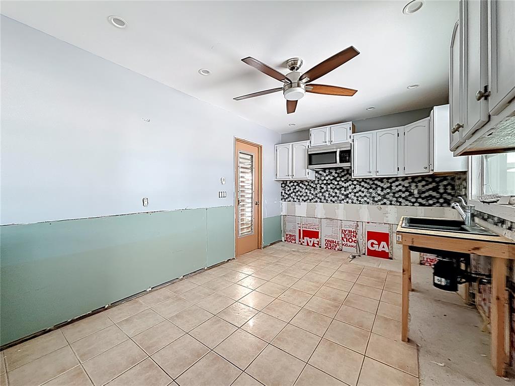 4869 Shell Stream Boulevard New Port Richey, FL 34652 - Photo 21 of 46 a room with lots of appliances and a window