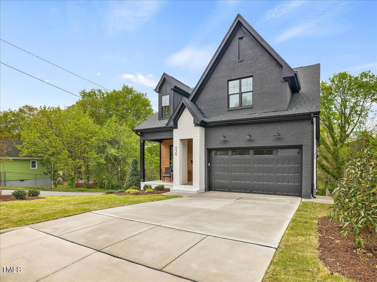 734 South State Street Raleigh, NC 27601 - Photo 2 of 95 a front view of a house with a yard