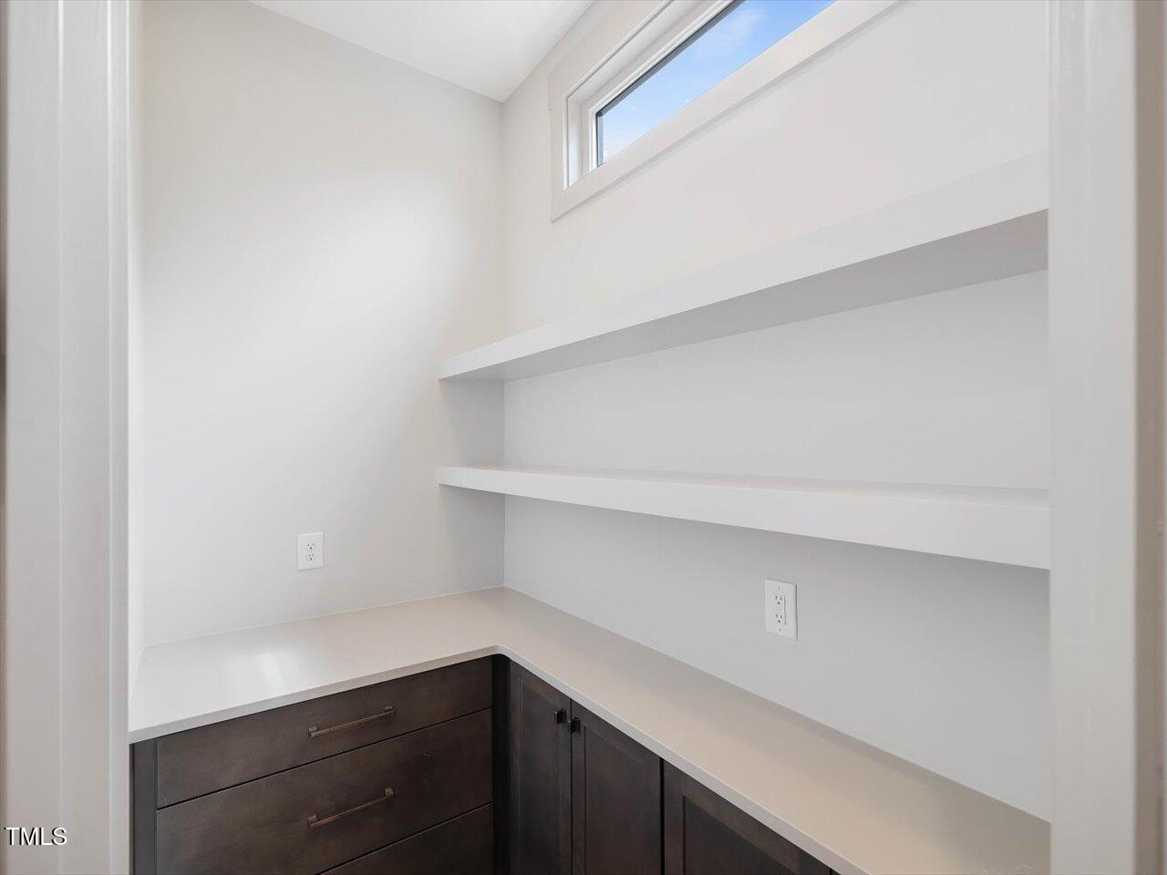 734 South State Street Raleigh, NC 27601 - Photo 23 of 95 a kitchen with a white cabinets and a wooden floor
