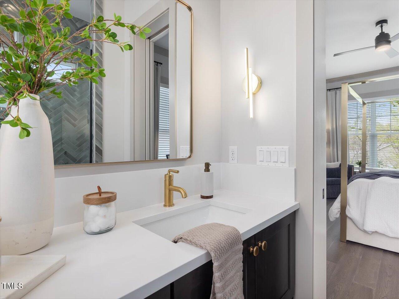 734 South State Street Raleigh, NC 27601 - Photo 42 of 95 a bathroom with a sink and a mirror