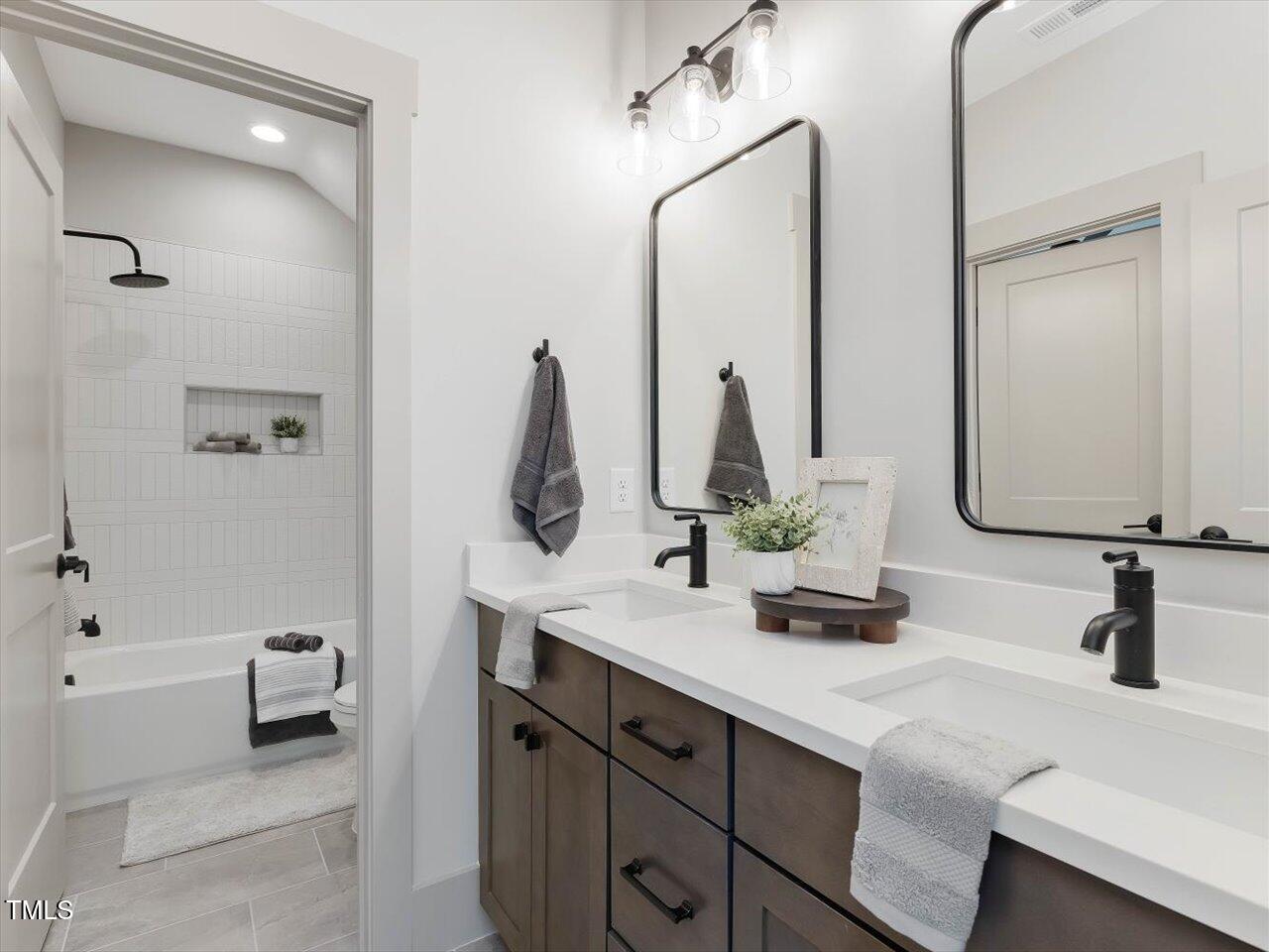 734 South State Street Raleigh, NC 27601 - Photo 59 of 95 a bathroom with a sink and a mirror