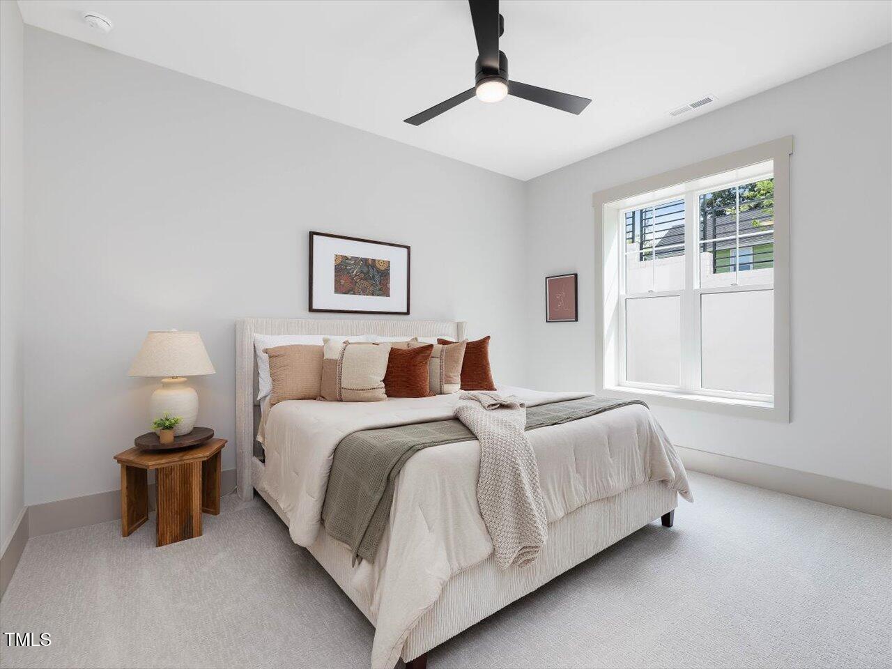 734 South State Street Raleigh, NC 27601 - Photo 83 of 95 a bed room with a bed and a lamp