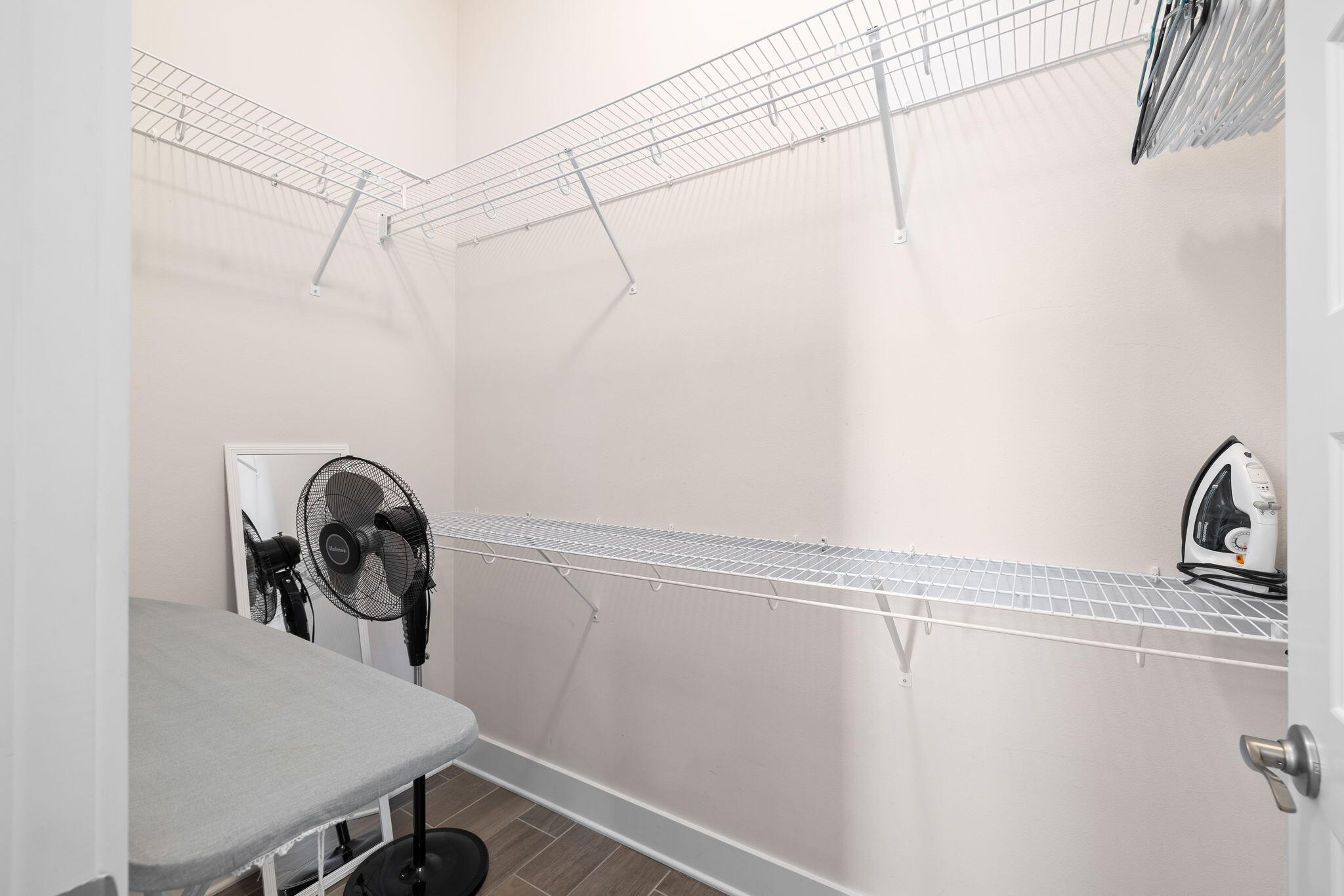 33 Milestone Dr Inlet Beach, Unit A Inlet Beach, FL 32461 - Photo 28 of 41 a view of a storage and utility room with racks on the wall