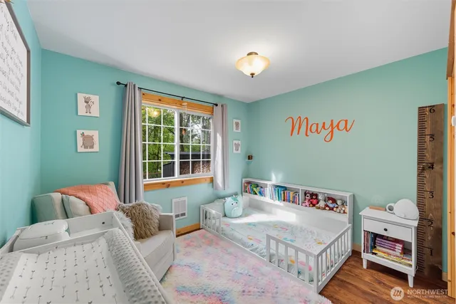 a bedroom with a bed and a book shelf