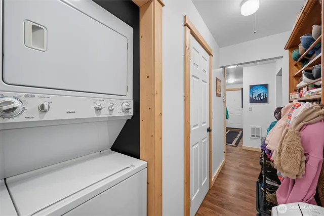 a view of a bedroom with wooden floor and stairs