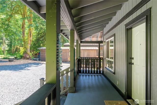 a living room with furniture stove and a window