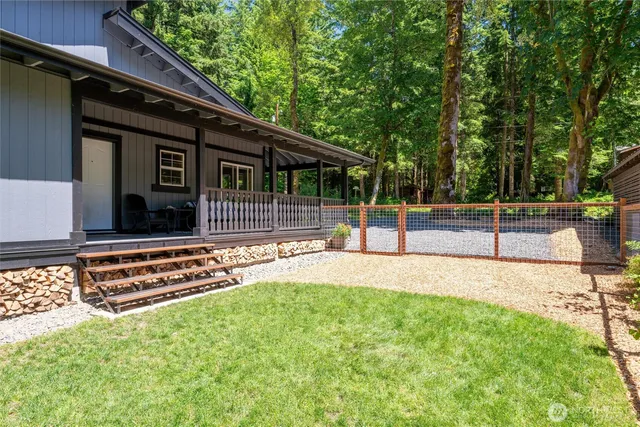 a house view with a sitting space and garden