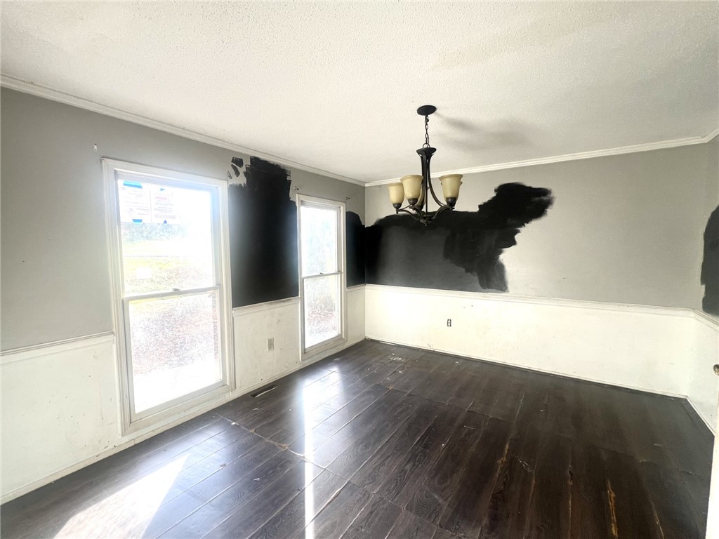 606 Timberlake Road Anderson, SC 29625 - Photo 4 of 12 This versatile room offers ample natural light and rich wood flooring.