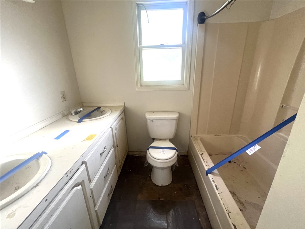 606 Timberlake Road Anderson, SC 29625 - Photo 6 of 12 This bathroom offers essential fixtures and natural light, ready for personalized updates.