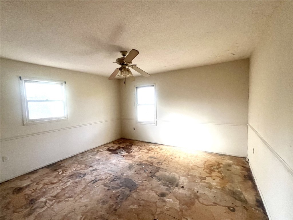 606 Timberlake Road Anderson, SC 29625 - Photo 7 of 12 This bedroom offers ample natural light and a ready-for-renovation space.