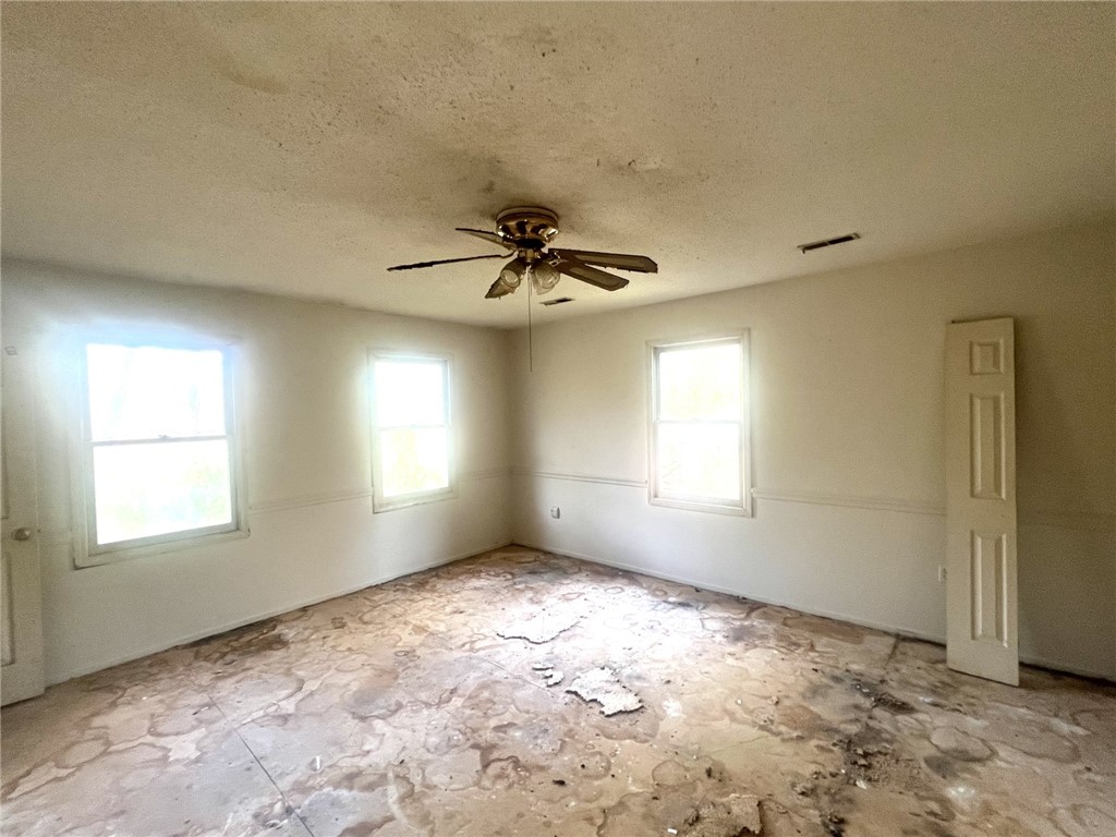 606 Timberlake Road Anderson, SC 29625 - Photo 8 of 12 This spacious room offers natural light and a unique flooring texture, awaiting your personal touch.