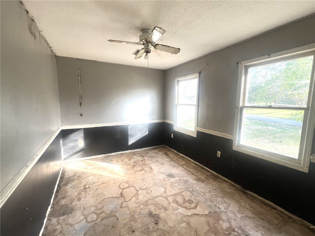 606 Timberlake Road Anderson, SC 29625 - Photo 9 of 12 This versatile room offers ample natural light, providing a bright and airy atmosphere.