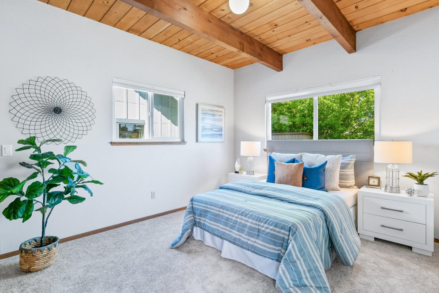 620 Sumner Street Santa Cruz, CA 95062 - Photo 16 of 45 a bedroom with bed and a potted plant