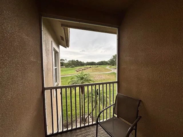 a view of a chair and table in balcony