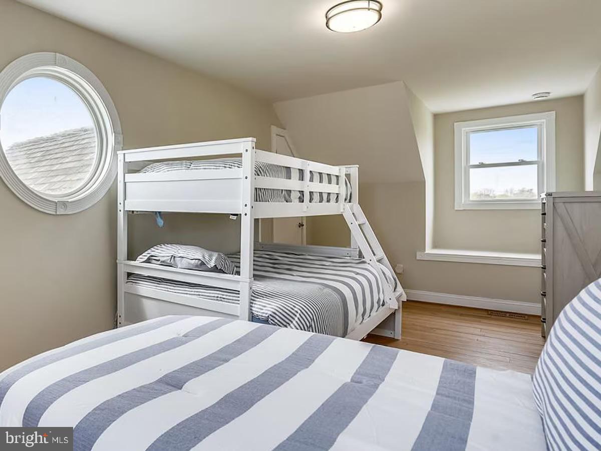 21642 Chicken Point Road Tilghman, MD 21671 - Photo 49 of 63 a bedroom with a bed and a window