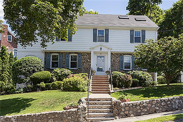 101 Douglas Road Belmont, MA 02478 - Photo 1 of 18 a front view of a house with a yard and potted plants