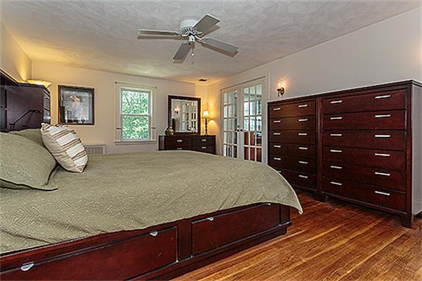 101 Douglas Road Belmont, MA 02478 - Photo 8 of 18 a bedroom with a bed and a dresser