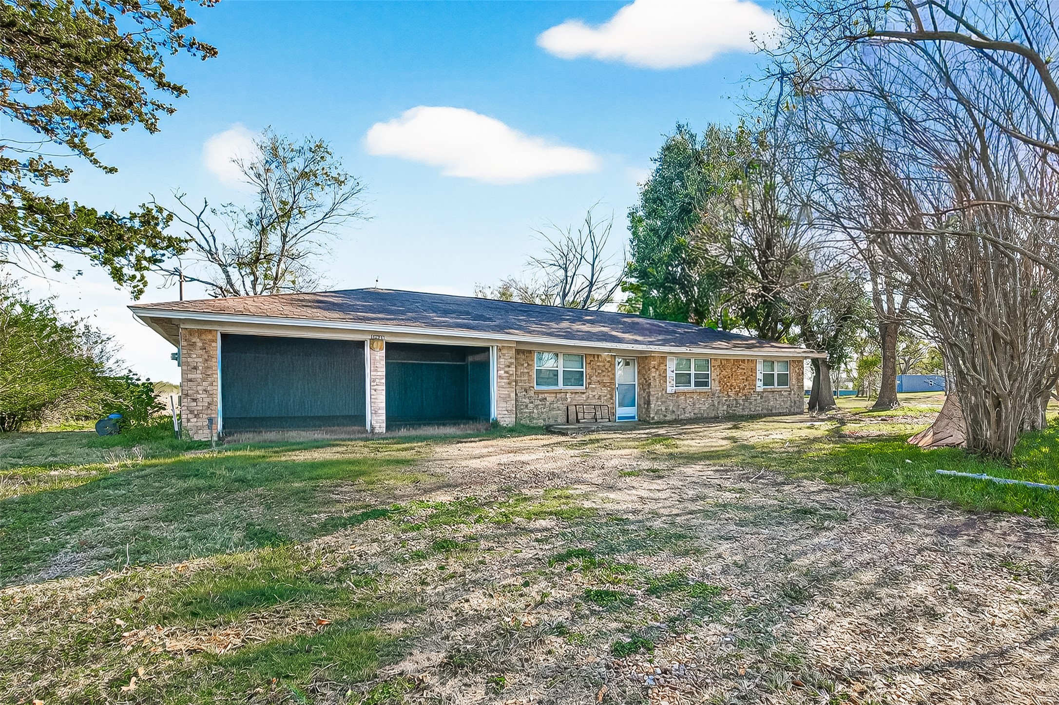 a house that has a tree in front of the house