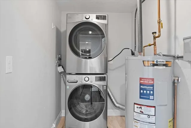 a view of a house with yard and a tree