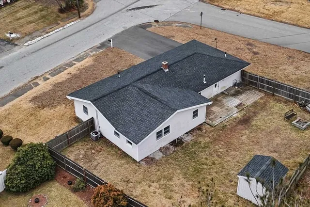 a view of a house with a backyard