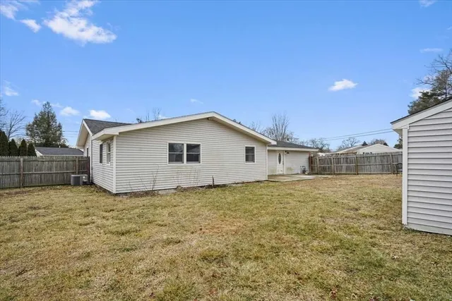 a aerial view of a house with a yard