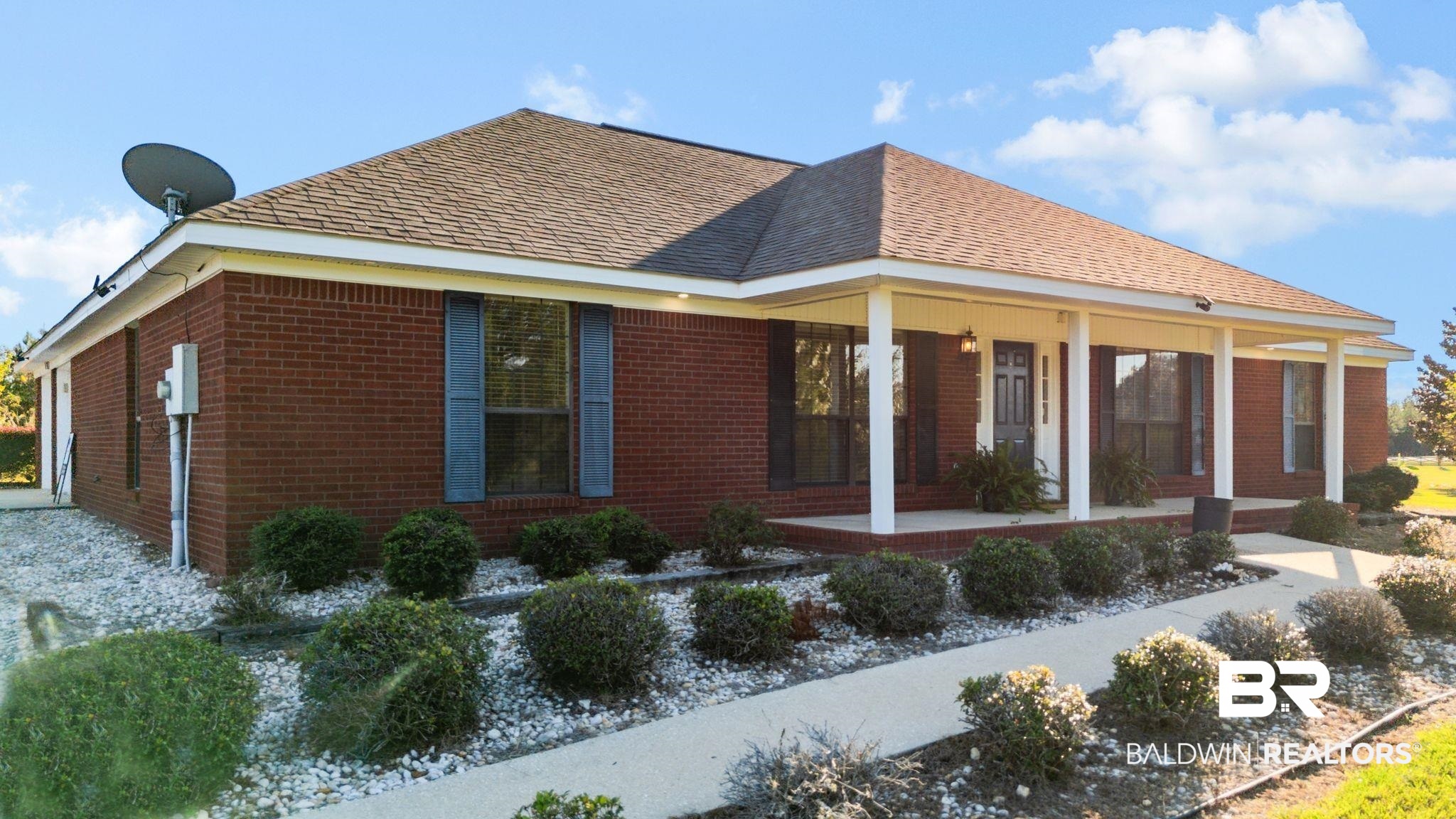 888 Mobile Cut-Off Road St. Stephens, AL 36569 - Photo 46 of 54 View of side of home with a porch, roof with shingles, and brick siding