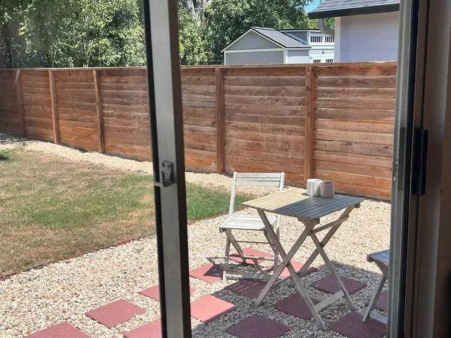 a view of a balcony with a patio