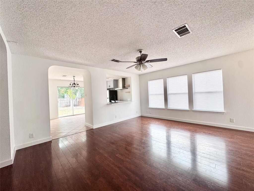 3204 Elizabeth Anne Lane Round Rock, TX 78664 - Photo 5 of 17 a view of an empty room with wooden floor and a window