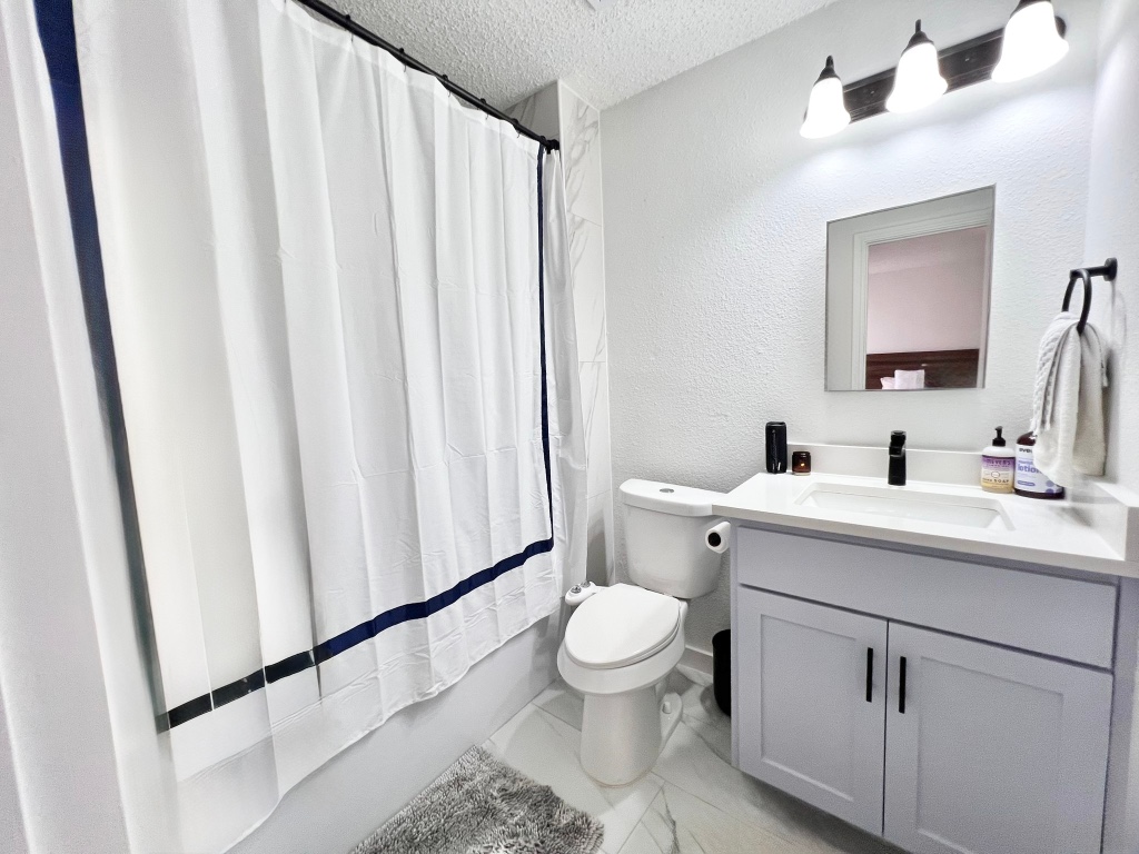 3204 Elizabeth Anne Lane Round Rock, TX 78664 - Photo 8 of 17 a bathroom with a sink a toilet and shower
