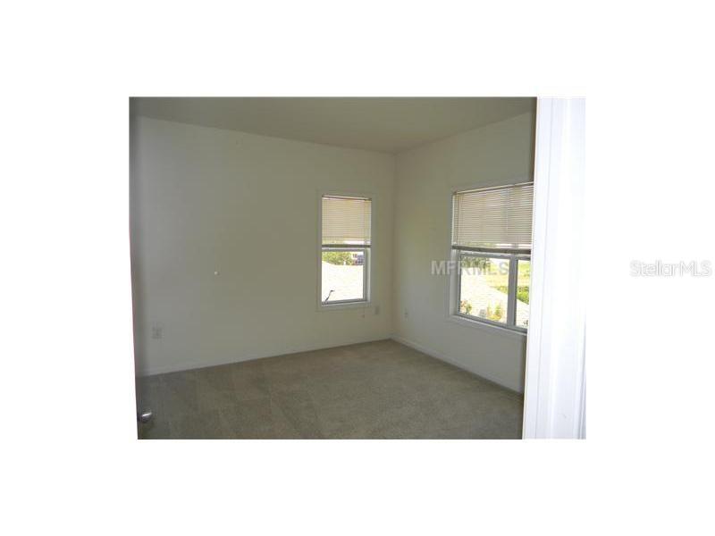 4802 51st Street West, Unit 1224 Bradenton, FL 34210 - Photo 8 of 10 a view of an empty room with a window