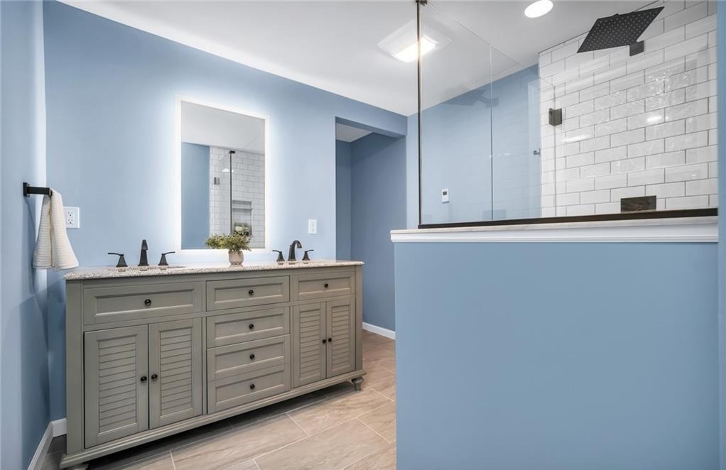 346 Middlebury Road Middlebury, CT 06762 - Photo 13 of 22 a bathroom with a granite countertop sink mirror and