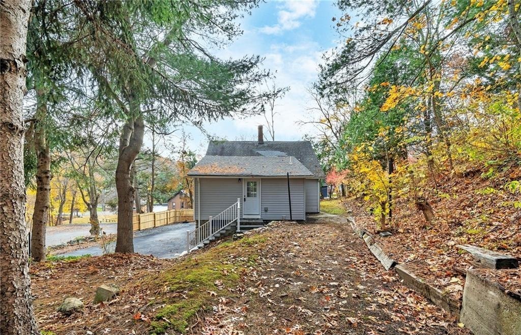 346 Middlebury Road Middlebury, CT 06762 - Photo 21 of 22 a front view of a house with a yard