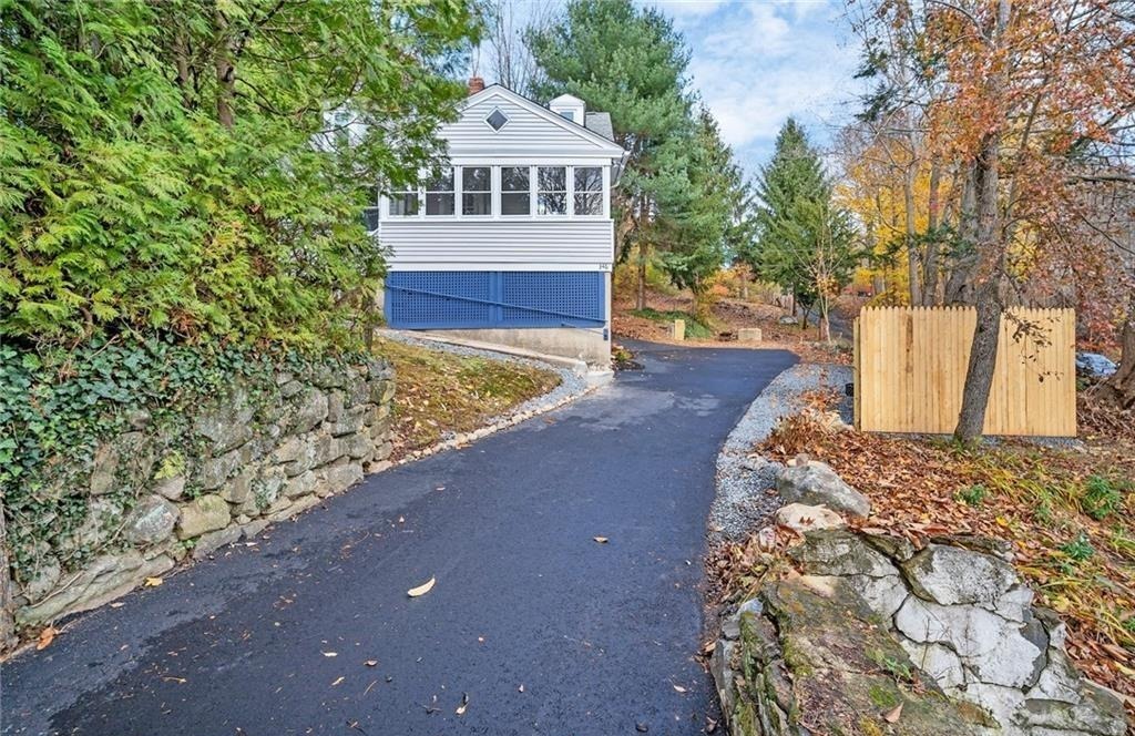 346 Middlebury Road Middlebury, CT 06762 - Photo 22 of 22 a front view of a house with a yard