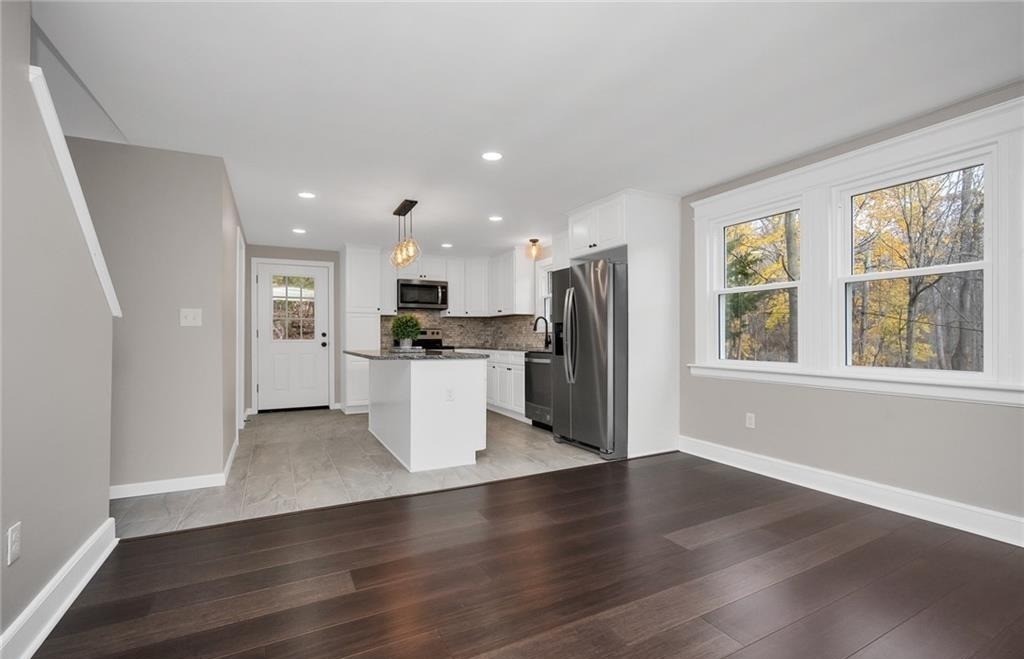 346 Middlebury Road Middlebury, CT 06762 - Photo 4 of 22 a view of kitchen with stainless steel appliances refrigerator microwave and stove