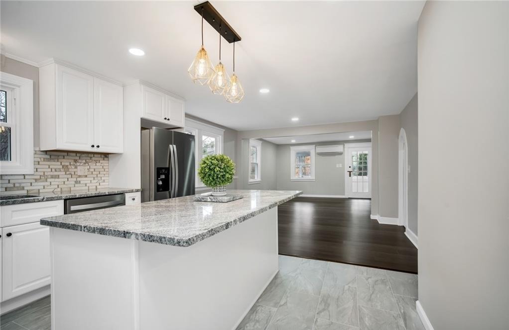 346 Middlebury Road Middlebury, CT 06762 - Photo 7 of 22 a view of a kitchen with center island and stainless steel appliances