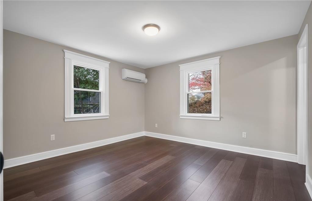 346 Middlebury Road Middlebury, CT 06762 - Photo 10 of 22 a view of an empty room with wooden floor and a window