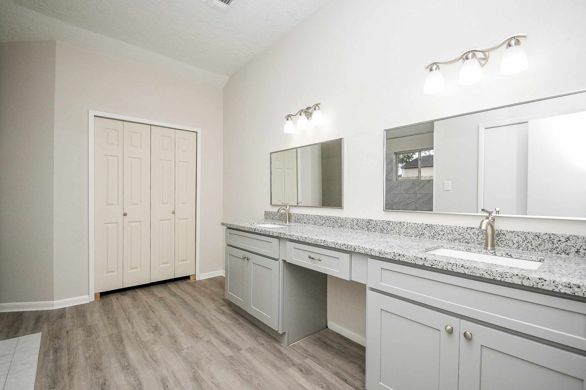 15315 Cedar Ridge Drive Houston, TX 77082 - Photo 12 of 20 a bathroom with a granite countertop double vanity sink and mirror