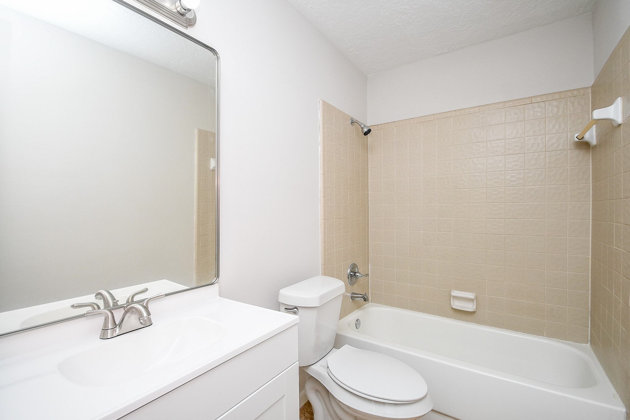 15315 Cedar Ridge Drive Houston, TX 77082 - Photo 16 of 20 a bathroom with a sink a toilet and a bathtub