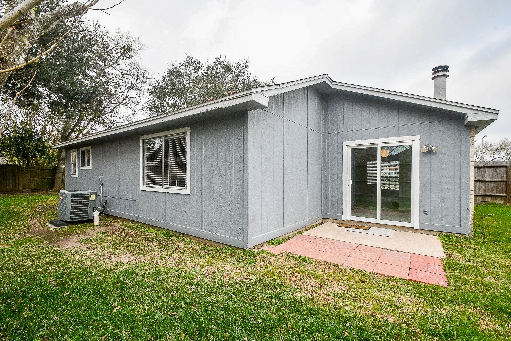 15315 Cedar Ridge Drive Houston, TX 77082 - Photo 19 of 20 a backyard of a house with yard and barbeque oven