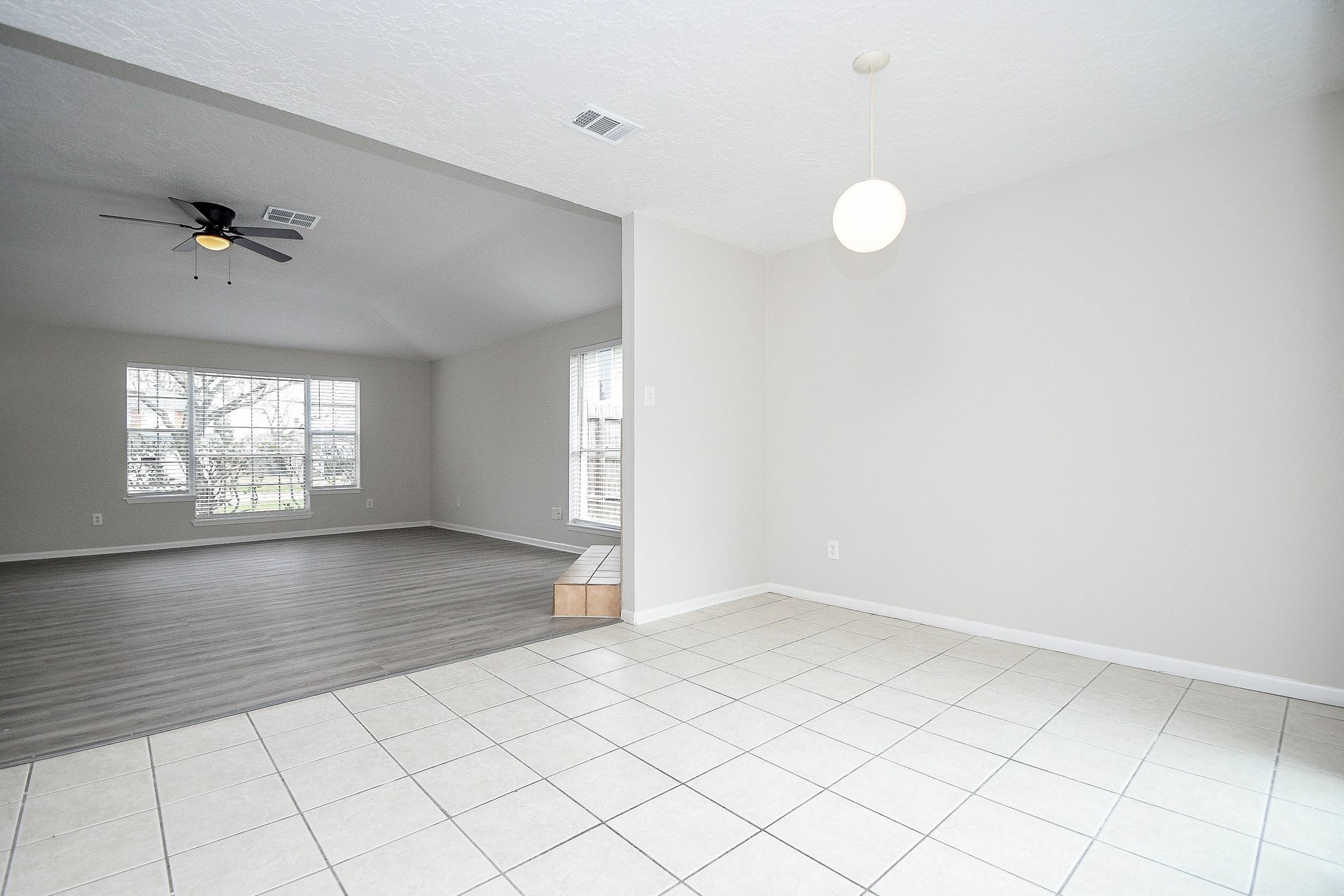 15315 Cedar Ridge Drive Houston, TX 77082 - Photo 4 of 20 wooden floor in an empty room with a window
