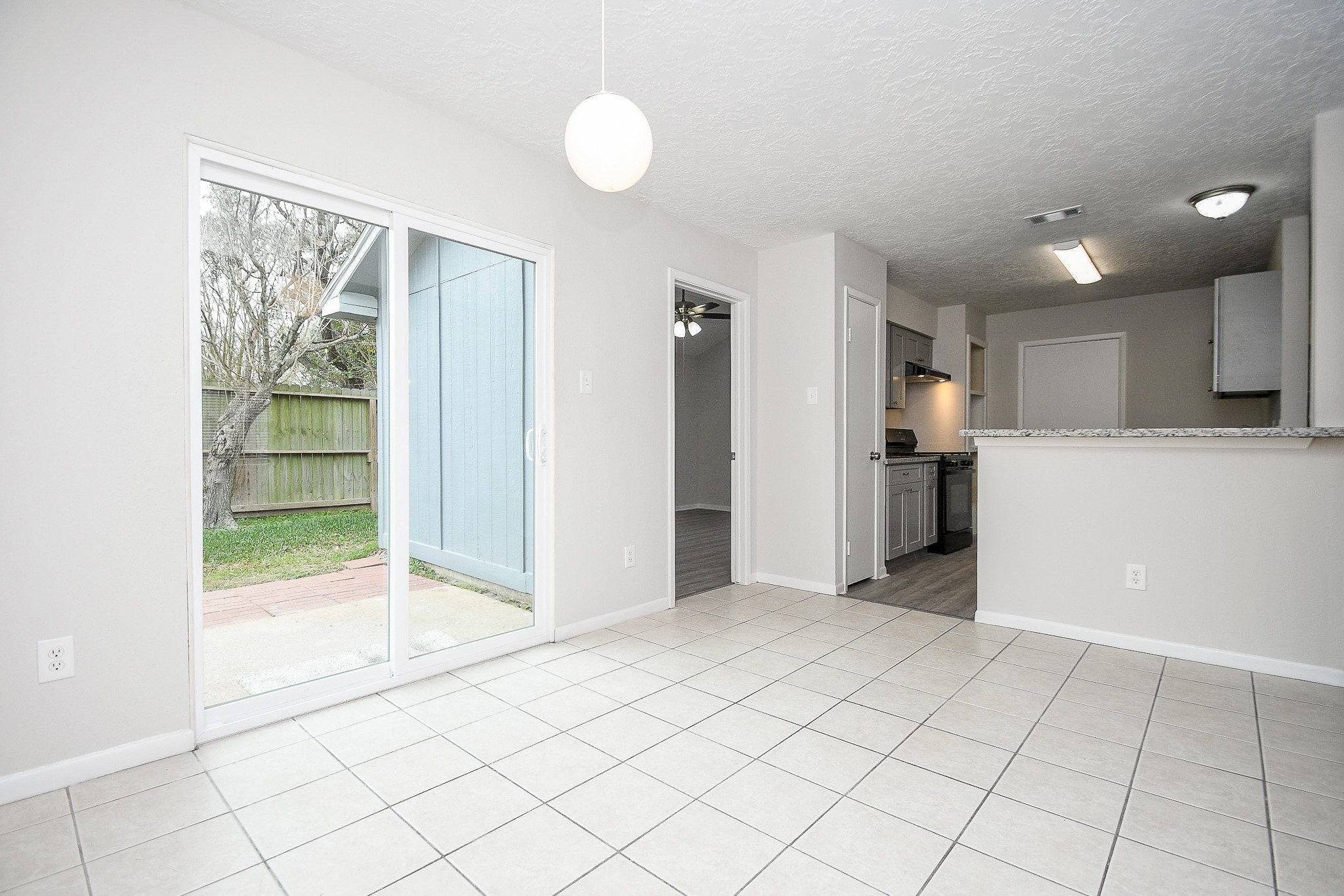 15315 Cedar Ridge Drive Houston, TX 77082 - Photo 5 of 20 a view of a kitchen with an empty space and a window