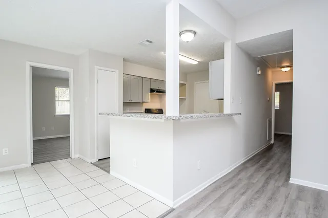 a kitchen with a stove and a sink