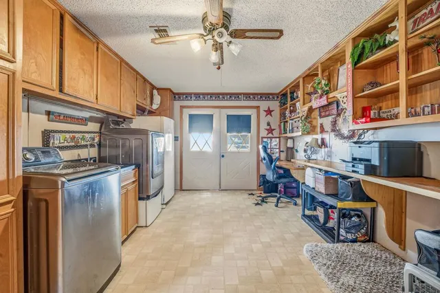a view of a storage & utility room with washer and dryer