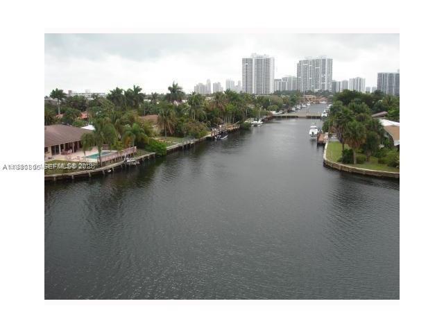 301 Golden Isles Drive, Unit 211 Hallandale Beach, FL 33009 - Photo 1 of 7 a open area with view of lake