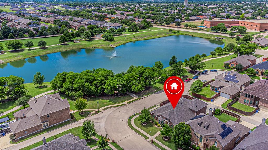 1805 Stetson Way Allen, TX 75002 - Photo 1 of 22 Aerial perspective showcasing the residential area with a prominent body of water featuring a fountain