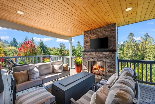 a outdoor living space with furniture and a fireplace