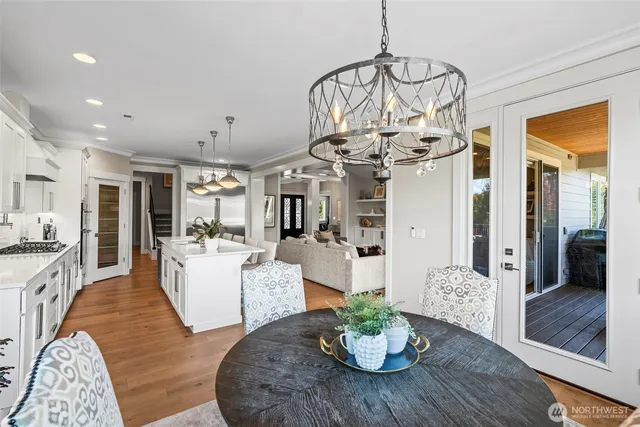 a living room with fireplace furniture and a chandelier
