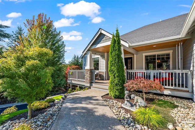 a front view of a house with garden